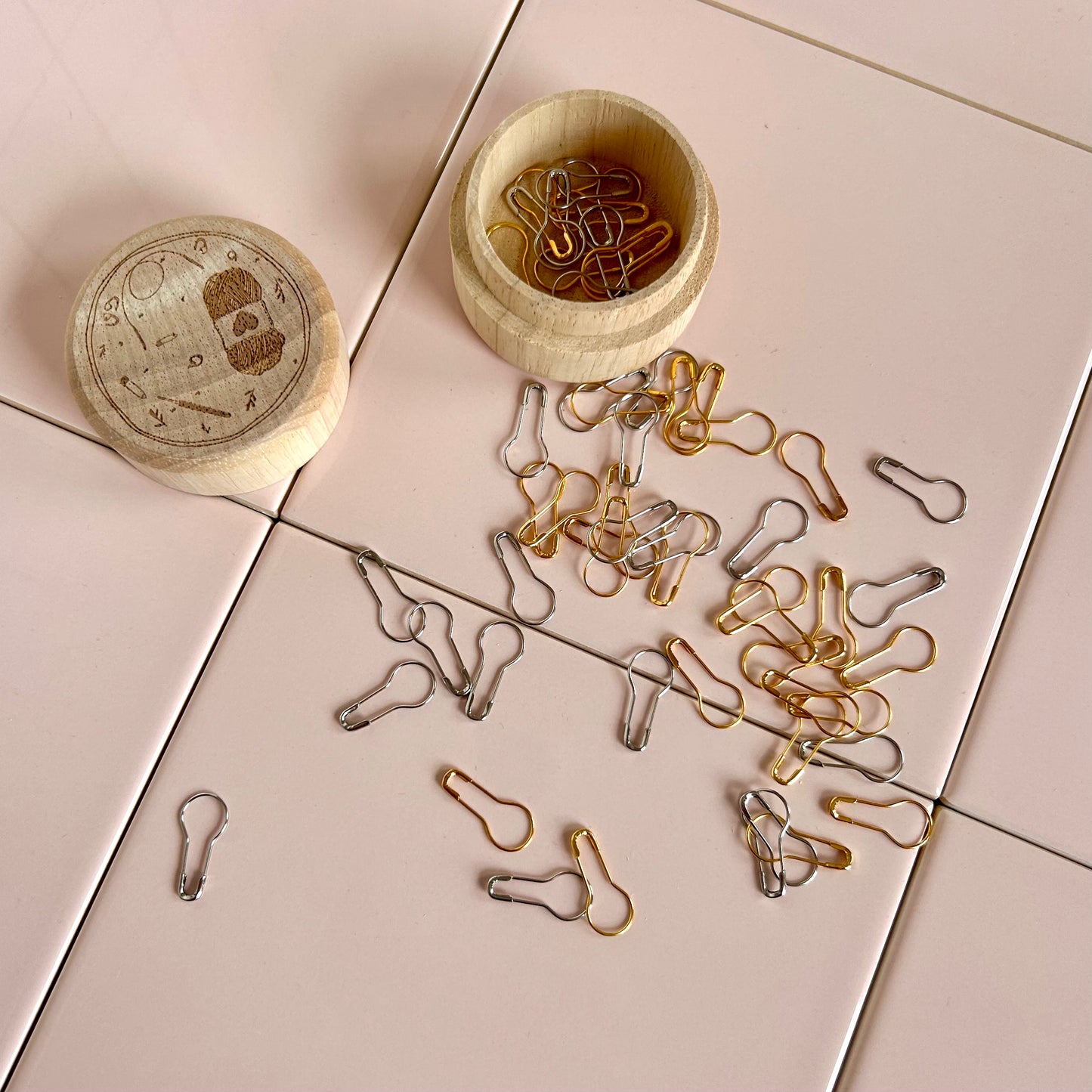 wooden box of metal stitch markers in gold and silver, set of approximately 50 stitch markers
