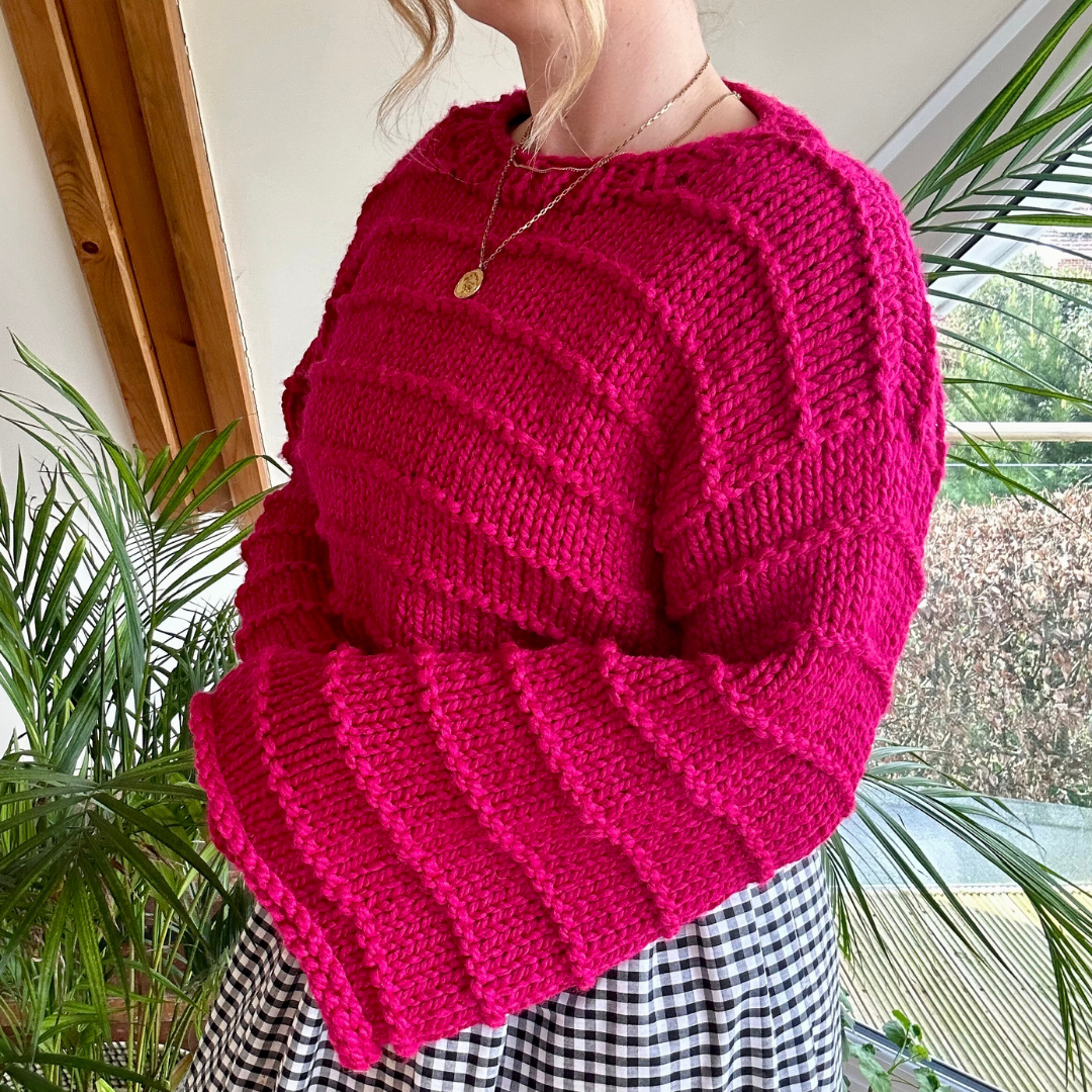 chunky jumper knitting pattern - the Ella jumper - girl wearing pink knitted jumper