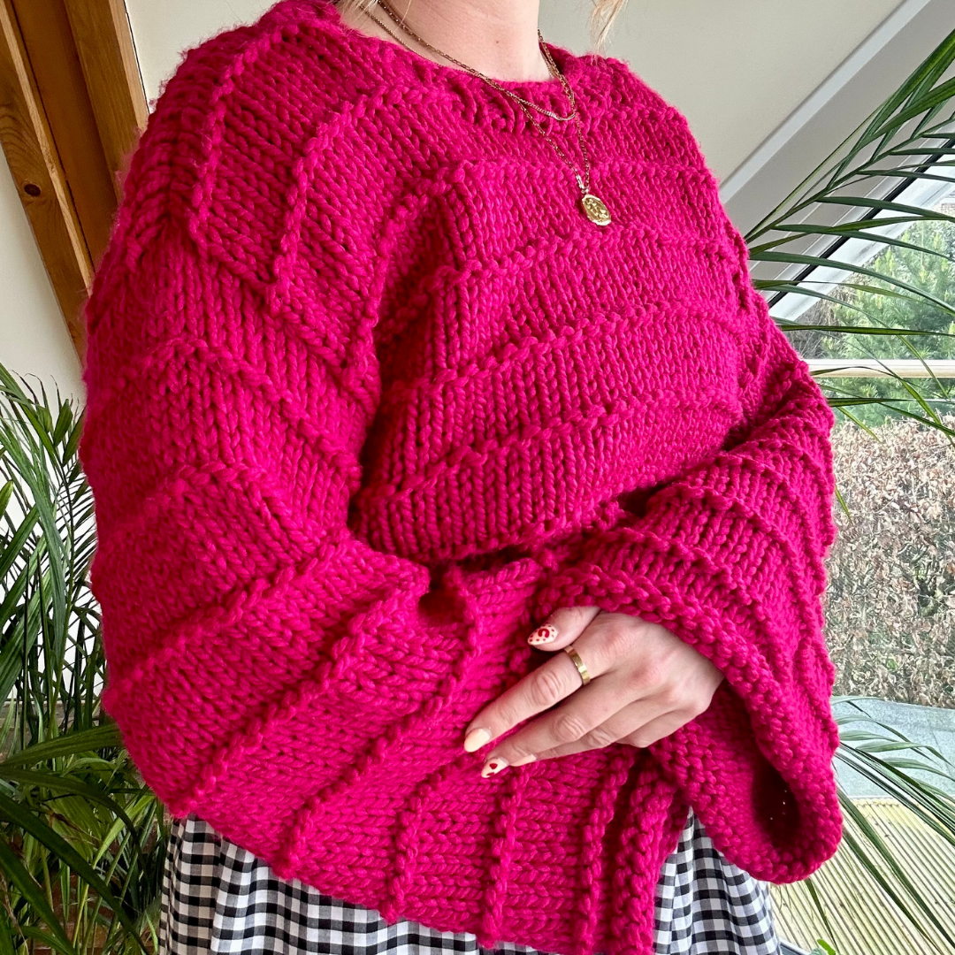 chunky jumper knitting pattern - the Ella jumper - girl wearing pink knitted jumper