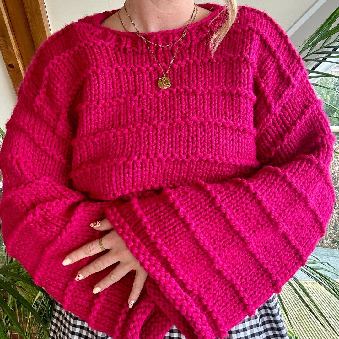 chunky jumper knitting pattern - the Ella jumper - girl wearing pink knitted jumper