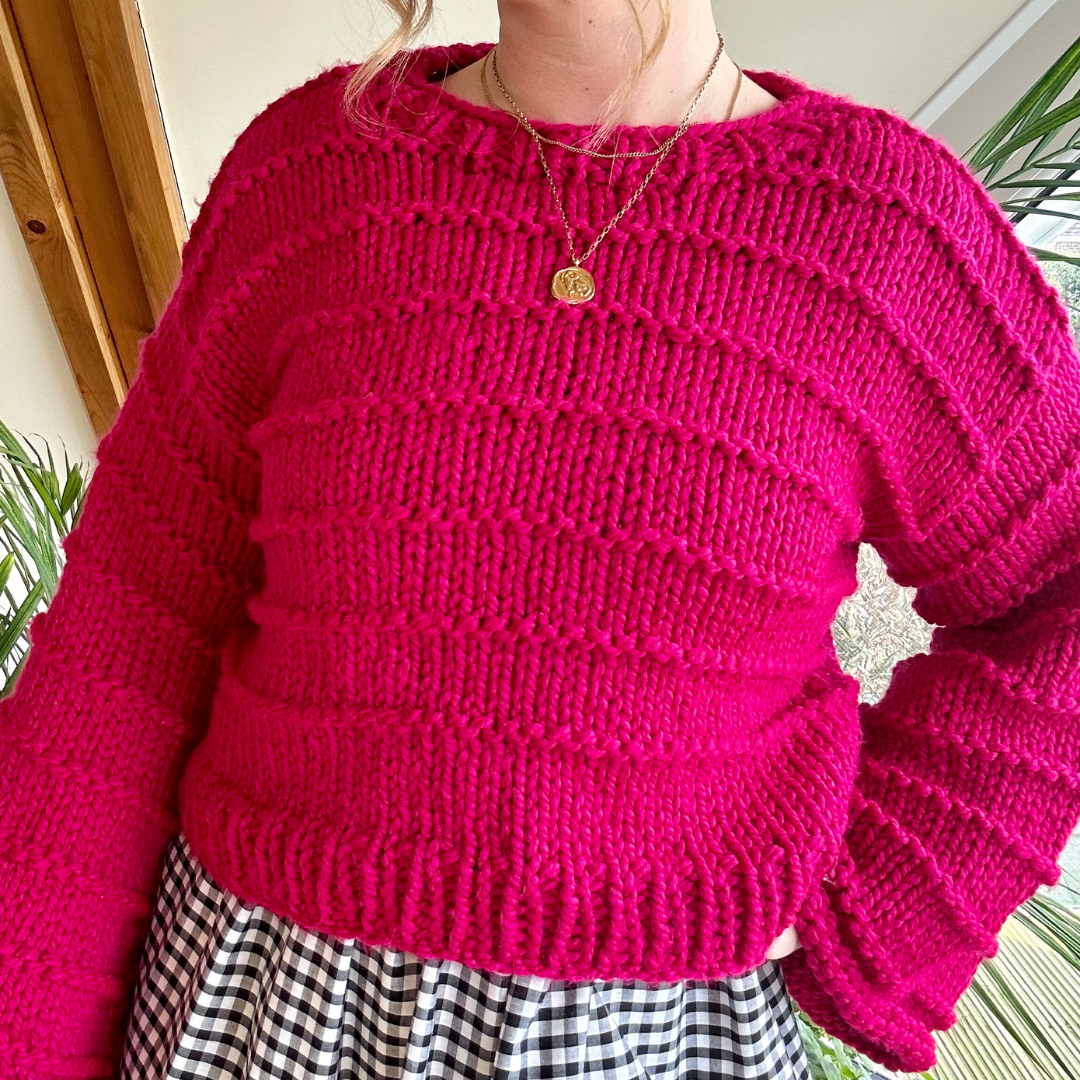 chunky jumper knitting pattern - the Ella jumper - girl wearing pink knitted jumper